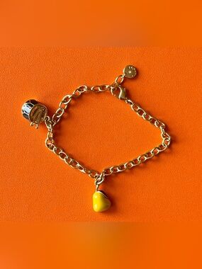 Talbots Charm Bracelet with holiday drum & yellow pear .